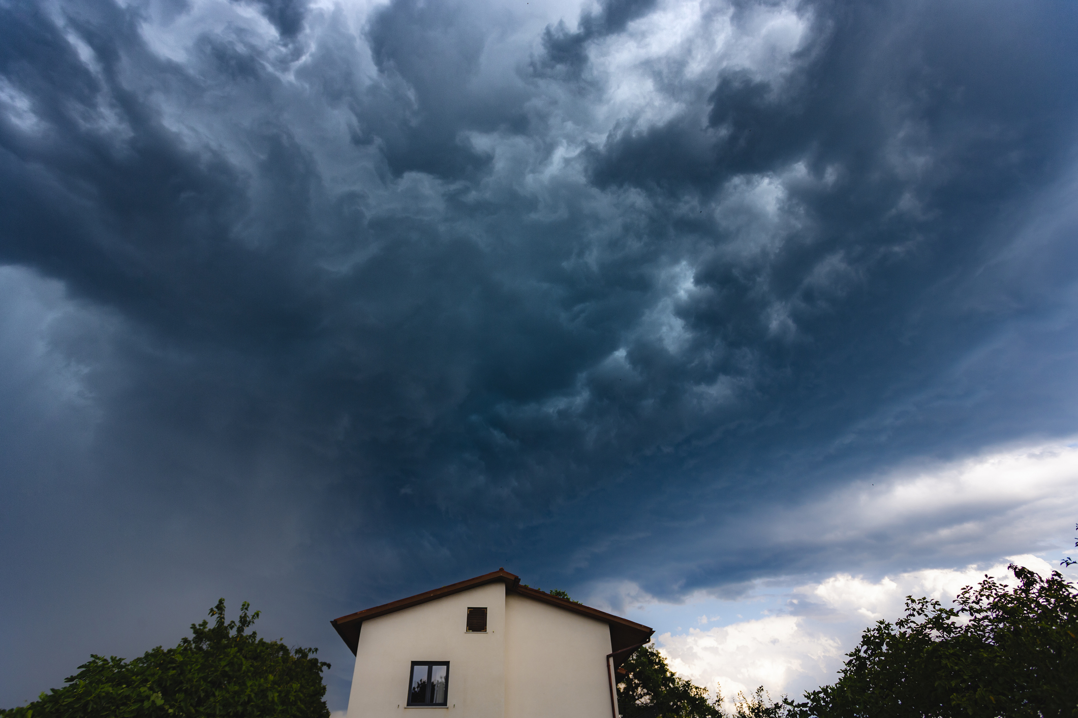 Summer storm approaching a residential home